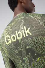 Gobik cycling jersey with green circuit board grid pattern worn by model