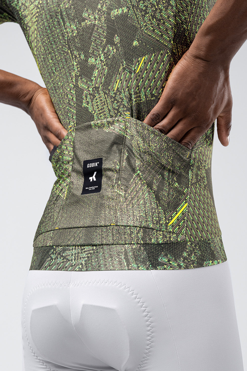Gobik CX Pro 4.0 cycling jersey in green grid pattern with professional studio lighting