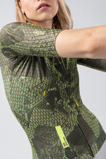 Gobik CX Pro 4.0 cycling jersey in green geometric pattern worn by model