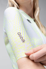 Gobik CX Pro cycling jersey in white with bright green Amazonian pattern worn by model