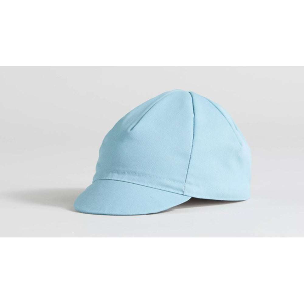 Specialized Cotton Cycling Cap in light blue with short brim on neutral background