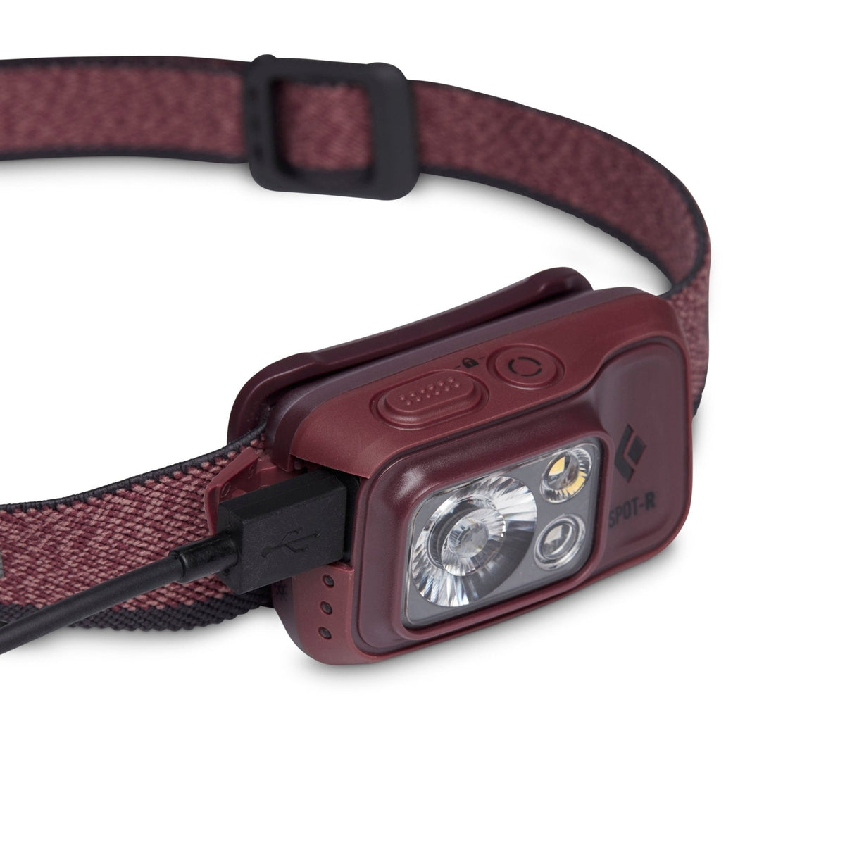 Black Diamond Spot-R bordeaux headlamp with USB charging cable connected, angled product view