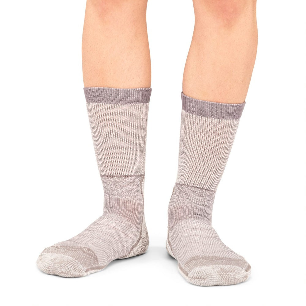 Thorlos Outdoor Explore MW Crew socks in grey worn on legs, shown from front