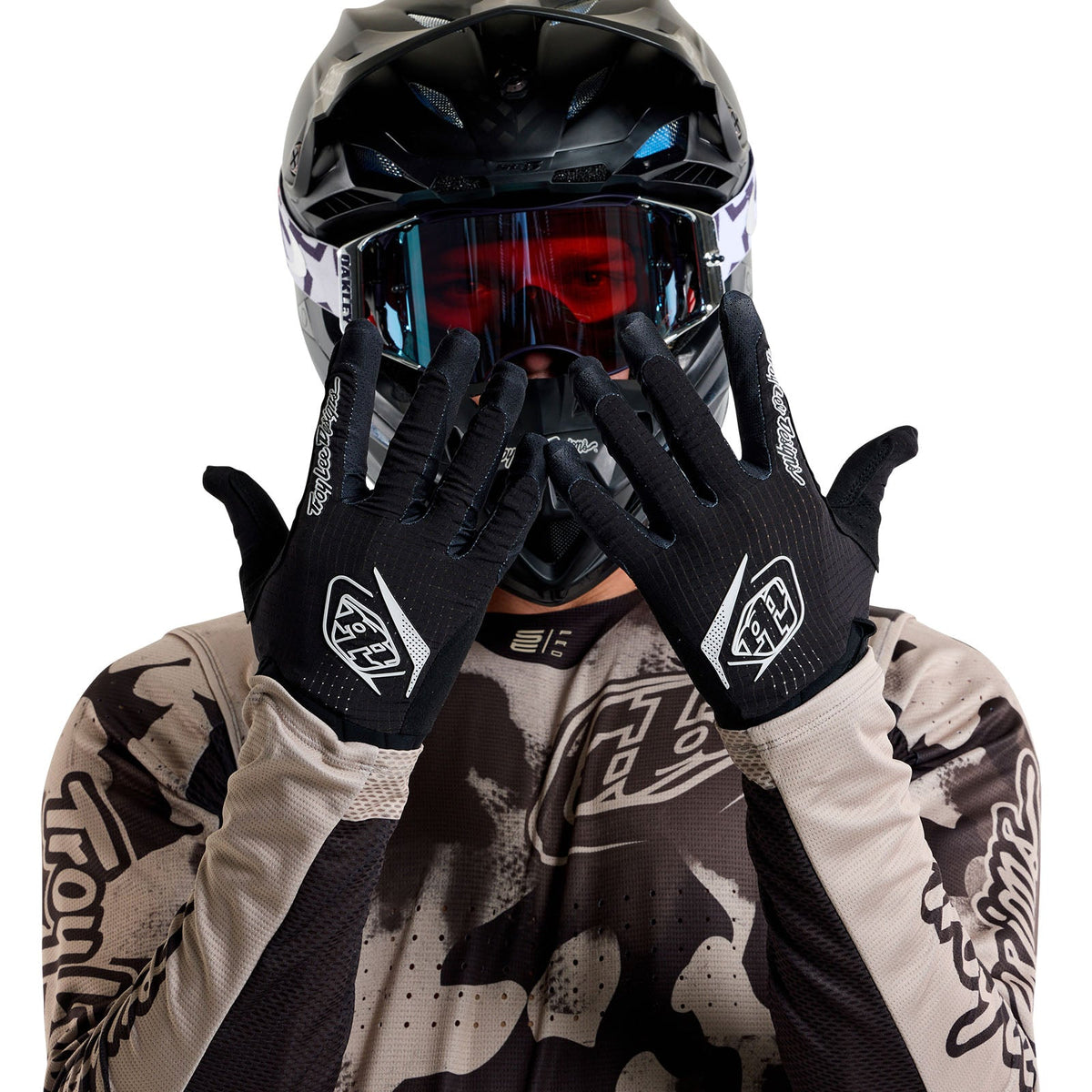Troy Lee Designs TLD Air Gloves in black worn by motocross rider with helmet