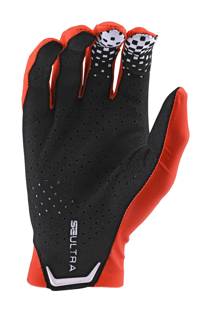 Troy Lee Designs SE Ultra glove in orange and black, palm view showing perforated grip