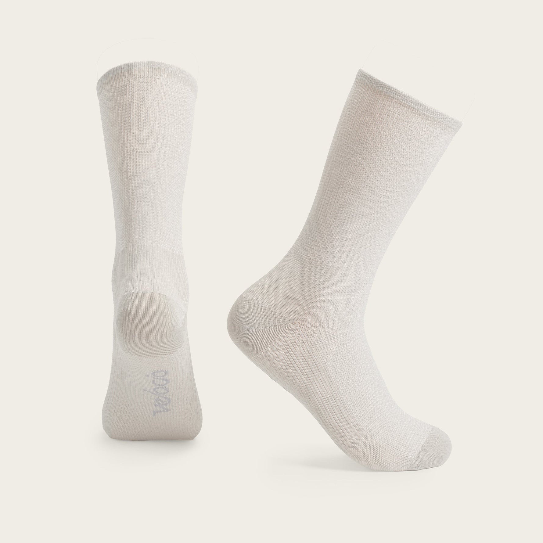 Velocio Ultralight cycling socks in misty rose color against clean white background