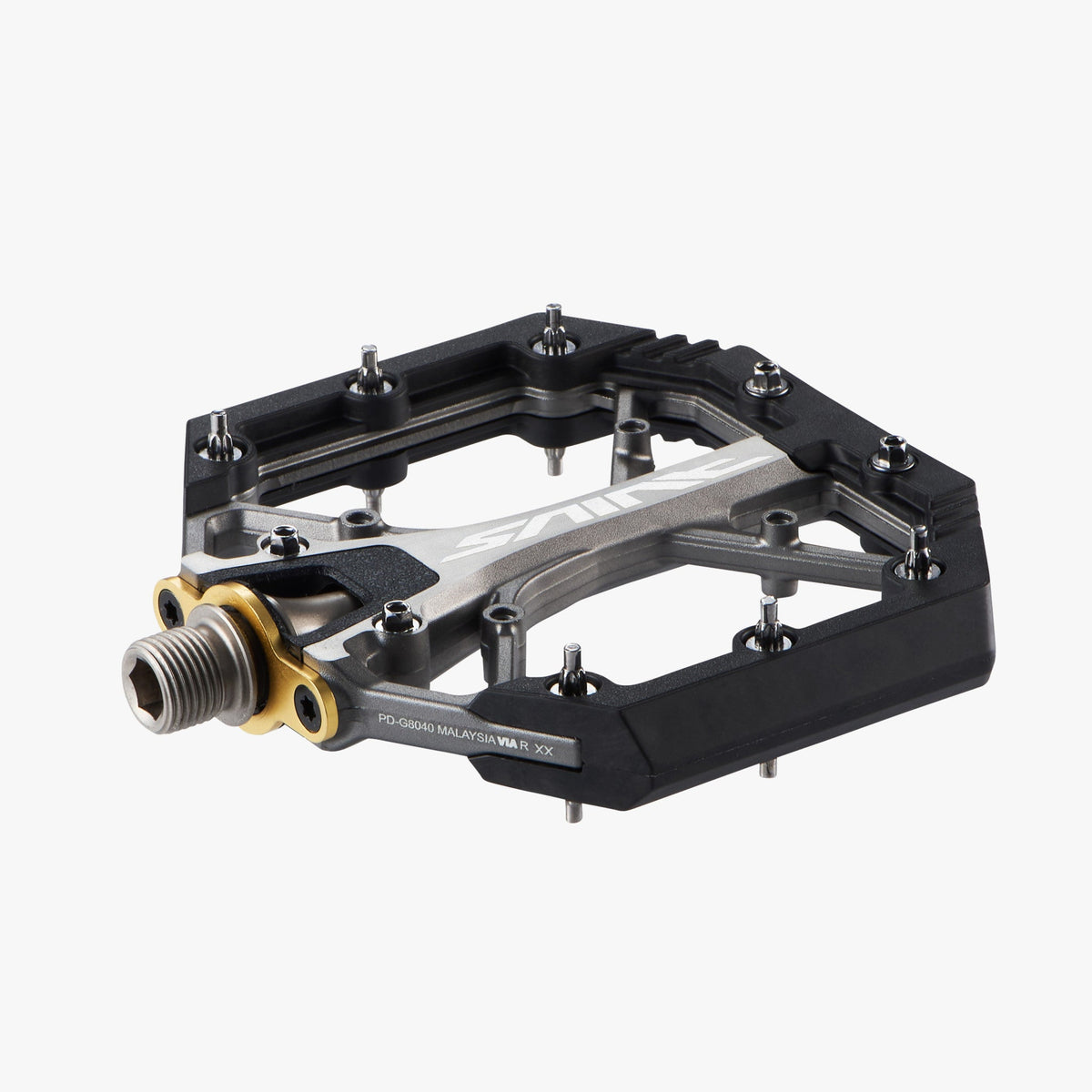 Shimano Saint PD-G8040 flat pedal angled view showing bottom traction pins and model number